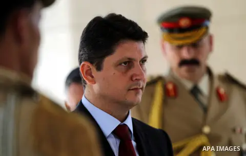 Romanian Foreign Minister Titus Corlatean lays a wreath at the grave site of the late Palestinian leader Yasser Arafat during an official visit to the West Bank city of Ramallah on October 10, 2012. Corlatean is on an of...