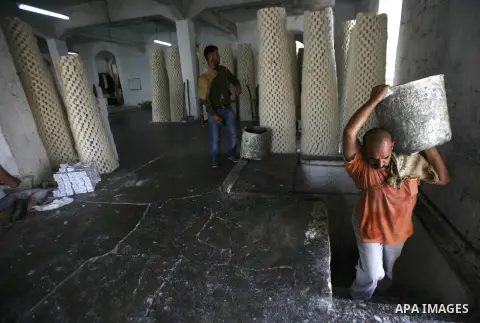 A Palestinian worker lines up soap pieces at the Touqan factory in the West Bank city of Nablus, on Oct. 11, 2012. The Touqan factory is one of the oldest manual factories in Nablus that manufactures the natural ''Nabuls...