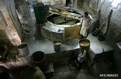 Palestinian workers prepare soap at the Touqan factory in the West Bank city of Nablus, on Oct.11, 2012. The Touqan factory is one of the oldest manual factories in Nablus that manufactures the natural ''Nabulsi Soap'' s...