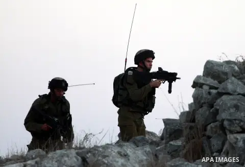 Israeli settlers from Bracha settlement throw stones at Palestinian farmers from the West Bank village of Burin, north of Nablus, during clashes on October 10, 2012. Over 100 olive trees belonging to Palestinians in a We...
