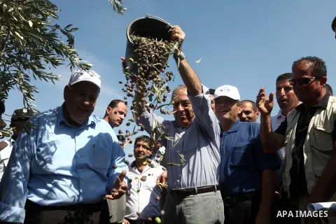 Palestinian Prime Minister Salam Fayyad attends the opening of olive harvest season in the village of Jayyous in the West Bank city of Qalqilya,11 October 2012. Photo by Mustafa Abu Dayeh