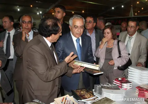 Palestinian Prime Minister visits the Palestine Book Fair Exhibition during the lunch of the exhibition, in the West Bank city of Ramallah , Oct. 11, 2012. The Palestine 8th Book Fair has participated with more than 200...