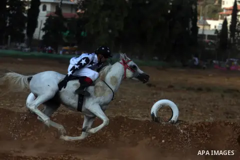 Palestinian jockeys race during an annual championship in the West Bank village of Turmus Aya, near Ramallah October 12, 2012. Some 60 competitors took part in the third annual local championship organised by the Turmus...