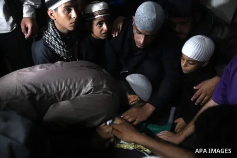 Palestinians pay their final respect to the Salafist leader Hisham al-Saedini during his funeral procession at Al-Bureij refugee camp in the central Gaza Strip, on October 14, 2012. Saedini, a top Salafist leader whose I...