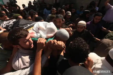 Palestinians pay their final respect to the Salafist leader Hisham al-Saedini during his funeral procession at Al-Bureij refugee camp in the central Gaza Strip, on October 14, 2012. Saedini, a top Salafist leader whose I...