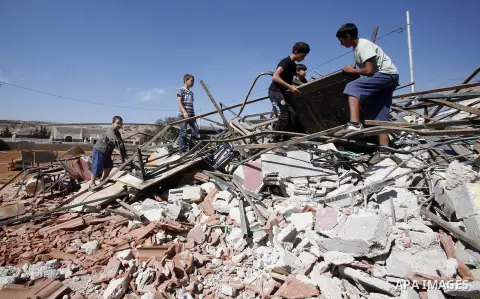 Palestinians inspect the damaged house that were built without a permit after it was demolished by an Israeli bulldozer, in the neighbourhood of Beit Hanina, in east Jerusalem, on Oct. 14, 2012. Israel regularly demolish...