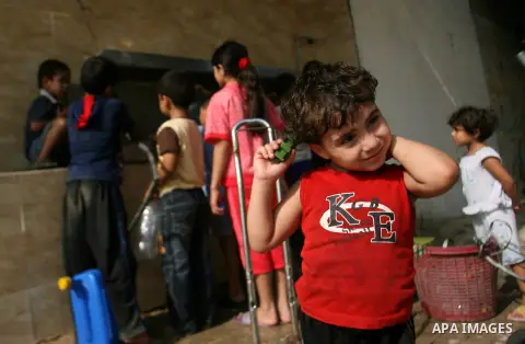 Palestinian children fill plastic bottles with drinking water in Rafah camp southern Gaza Strip, on Oct. 16, 2012. The residents of the Gaza strip suffer from lack of potable water, Israel continues to tighten its blocka...