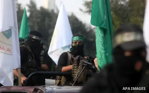 Palestinian Hamas militants take part in a march in the streets of Gaza City to mark the first anniversary of a deal which saw the exchange of 1,027 Palestinian prisoners for captured Israeli soldier Gilad Shalit, on Oct...