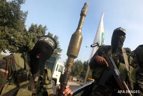 Palestinian Hamas militants take part in a march in the streets of Gaza City to mark the first anniversary of a deal which saw the exchange of 1,027 Palestinian prisoners for captured Israeli soldier Gilad Shalit, on Oct...