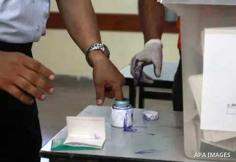 Members of the Palestinian security vote at a polling station during local elections in the West Bank city of Nablus, on October 18,2012. Members of Palestinian security forces cast an early vote ahead of local elections...