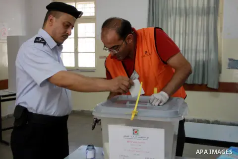 Members of the Palestinian security vote at a polling station during local elections in the West Bank city of Nablus, on October 18,2012. Members of Palestinian security forces cast an early vote ahead of local elections...