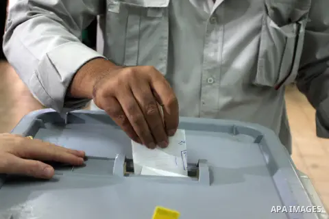A Palestinian police officer casts his vote at a polling station in the West bank town of Ramallah, 18 October 2012. The polling stations will be open from seven AM to seven PM for about 13,000 members of the security fo...