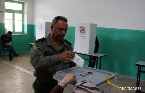 A member of Palestinian security forces casts his vote at a polling station in the West bank town of Ramallah, 18 October 2012. The polling stations will be open from seven AM to seven PM for about 13,000 members of the...