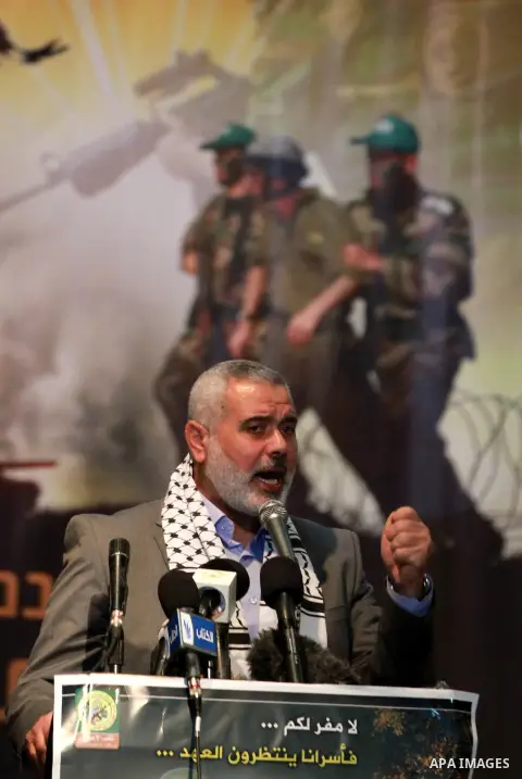 Palestinian Prime Minister in Gaza Ismail Haniyeh speaks during a ceremony to mark the first anniversary of a deal which saw the exchange of 1,027 Palestinian prisoners for captured Israeli soldier Gilad Shalit, in Gaza...