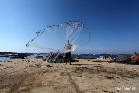 Palestinian fishermen prepare their nets in Gaza City's harbour on October 20, 2012. Israeli soldiers commandeered a vessel carrying pro-Palestinian activists destined for Gaza on Saturday, cutting off communications and...