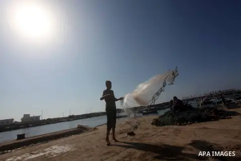 Palestinian fishermen prepare their nets in Gaza City's harbour on October 20, 2012. Israeli soldiers commandeered a vessel carrying pro-Palestinian activists destined for Gaza on Saturday, cutting off communications and...