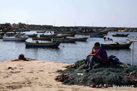 Palestinian fishermen prepare their nets in Gaza City's harbour on October 20, 2012. Israeli soldiers commandeered a vessel carrying pro-Palestinian activists destined for Gaza on Saturday, cutting off communications and...
