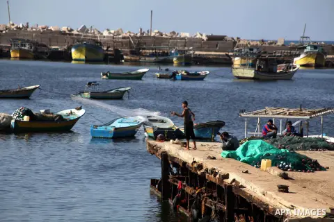 Palestinian fishermen prepare their nets in Gaza City's harbour on October 20, 2012. Israeli soldiers commandeered a vessel carrying pro-Palestinian activists destined for Gaza on Saturday, cutting off communications and...