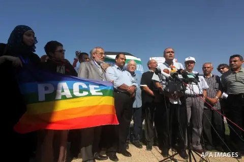 Jewish-American scholar and activist Noam Chomsky stands during a press conference to support the Gaza-bound flotilla in the port of Gaza City, Saturday, Oct. 20 , 2012. Israeli soldiers commandeered a vessel carrying pr...