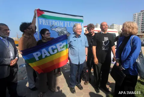 Jewish-American scholar and activist Noam Chomsky stands during a press conference to support the Gaza-bound flotilla in the port of Gaza City, Saturday, Oct. 20 , 2012. Israeli soldiers commandeered a vessel carrying pr...