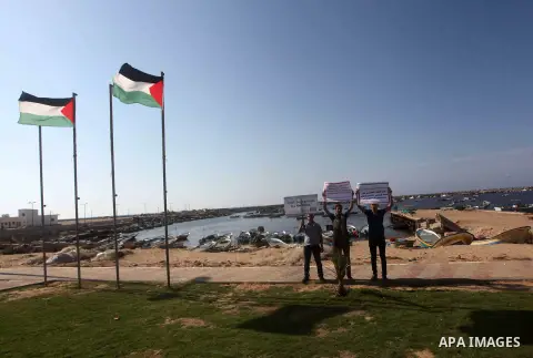 Palestinians participate a press conference to support the Gaza-bound flotilla in the port of Gaza City, Saturday, Oct. 20 , 2012. Israeli soldiers commandeered a vessel carrying pro-Palestinian activists destined for Ga...