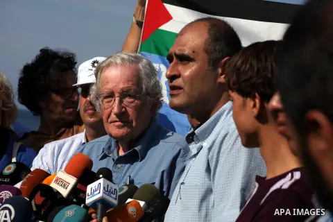 Jewish-American scholar and activist Noam Chomsky stands during a press conference to support the Gaza-bound flotilla in the port of Gaza City, Saturday, Oct. 20 , 2012. Israeli soldiers commandeered a vessel carrying pr...