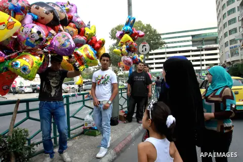 A Palestinian vendor sells ballons in preparing to the celebration of Eid al-Adha festival at a market in the West Bank city of Nablus, oct. 21, 2012. Muslims around the world prepare to celebrate Eid Al-Adha, which acco...