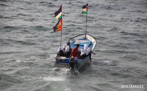 Palestinian girls ride on the deck of a boat off the coast of Gaza city during a school trip on October 21, 2012. Gaza beach is the only outlet for the Palestinians after tightening the Israeli blockade on the Gaza Strip...