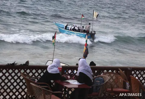 Palestinian girls ride on the deck of a boat off the coast of Gaza city during a school trip on October 21, 2012. Gaza beach is the only outlet for the Palestinians after tightening the Israeli blockade on the Gaza Strip...