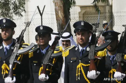 Palestinian Prime Minister in Gaza strip, Ismail Haniyeh walks with the Emir of Qatar Sheik Hamad bin Khalifa al-Thani during a welcoming ceremony at the Rafah border crossing with Egypt in the southern Gaza Strip Octobe...
