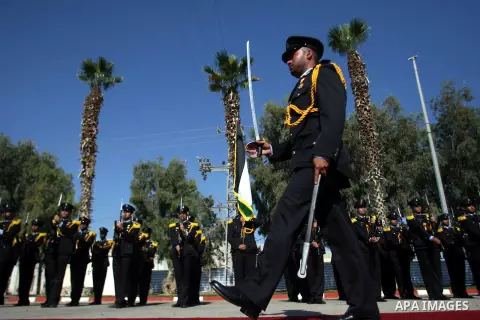 Palestinian honor guards greets Emir of Qatar Sheikh Hamad bin Khalifa al-Thani during a welcome ceremony in Rafah, southern Gaza Strip, Tuesday, Oct. 23, 2012. The Emir of Qatar entered the Gaza Strip on Tuesday for a v...