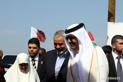 Palestinian Prime Minister in Gaza Strip, Ismail Haniyeh with the Emir of Qatar Sheik Hamad bin Khalifa al-Thani arrive to attend the opening ceremony for housing project in the southern Gaza Strip town of Khan Yunis, Oc...