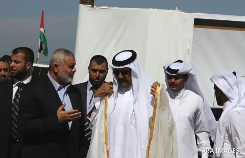 Palestinian Prime Minister in Gaza Strip, Ismail Haniyeh with the Emir of Qatar Sheik Hamad bin Khalifa al-Thani arrive to attend the opening ceremony for housing project in the southern Gaza Strip town of Khan Yunis, Oc...