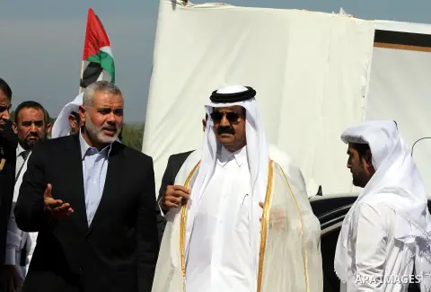 Palestinian Prime Minister in Gaza Strip, Ismail Haniyeh with the Emir of Qatar Sheik Hamad bin Khalifa al-Thani arrive to attend the opening ceremony for housing project in the southern Gaza Strip town of Khan Yunis, Oc...