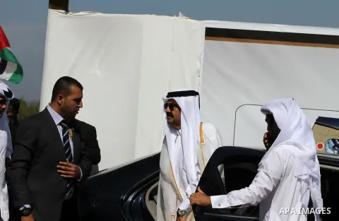 Palestinian Prime Minister in Gaza Strip, Ismail Haniyeh with the Emir of Qatar Sheik Hamad bin Khalifa al-Thani arrive to attend the opening ceremony for housing project in the southern Gaza Strip town of Khan Yunis, Oc...