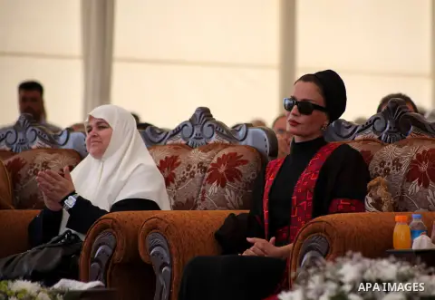 Qatar's First Lady Sheika Mozah bint Nasser al-Missned and Amal Haniyah, the wife of Gaza's prime minister Ismail Haniya attend the opening ceremony for housing project in the southern Gaza Strip town of Khan Yunis, Octo...