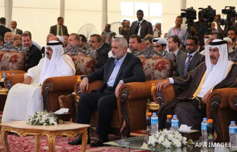 Palestinian Prime Minister in Gaza Strip, Ismail Haniyeh with the Emir of Qatar Sheik Hamad bin Khalifa al-Thani arrive to attend the opening ceremony for housing project in the southern Gaza Strip town of Khan Yunis, Oc...