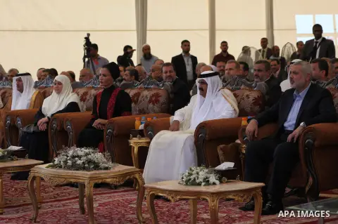 Palestinian Prime Minister in Gaza Strip, Ismail Haniyeh with the Emir of Qatar Sheik Hamad bin Khalifa al-Thani arrive to attend the opening ceremony for housing project in the southern Gaza Strip town of Khan Yunis, Oc...