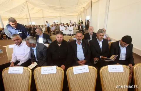Palestinian leaders attend the opening ceremony for housing project in the southern Gaza Strip town of Khan Yunis, October 23, 2012. The Emir of Qatar entered the Gaza Strip on Tuesday for a visit that broke the isolatio...