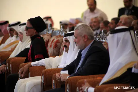 Palestinian Prime Minister in Gaza strip, Ismail Haniyeh and the Emir of Qatar Sheikh Hamad bin Khalifa al-Thani arrive at a cornerstone laying ceremony for Hamad, a new residential neighbourhood in Khan Younis in the so...