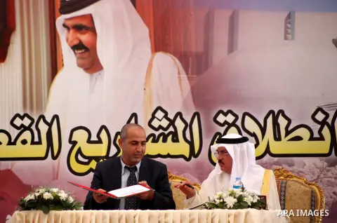Palestinians and Qataris sign agreements for projects during a cornerstone laying ceremony for Hamad, a new residential neighbourhood in Khan Younis in the southern Gaza Strip, 23 October 2012. The Emir of Qatar entered...