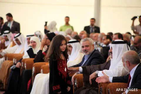 Palestinian Prime Minister in Gaza strip, Ismail Haniyeh and the Emir of Qatar Sheikh Hamad bin Khalifa al-Thani arrive at a cornerstone laying ceremony for Hamad, a new residential neighbourhood in Khan Younis in the so...