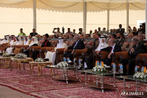 Palestinian Prime Minister in Gaza strip, Ismail Haniyeh and the Emir of Qatar Sheikh Hamad bin Khalifa al-Thani arrive at a cornerstone laying ceremony for Hamad, a new residential neighbourhood in Khan Younis in the so...