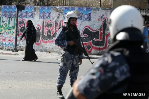 Palestinian Hamas security officers guard a road as they wait for the convoy of the Qatari Emir Sheikh Hamad bin Khalifa Al-Thani to arrive in Gaza City, Tuesday, Oct. 23,2012. The Emir of Qatar entered the Gaza Strip on...