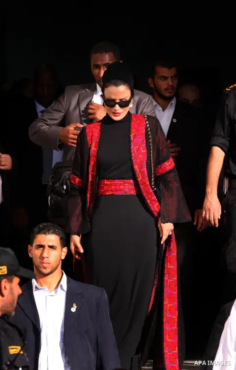 Qatar's First Lady Sheikha Mozah bint Nasser al-Missned leaves the Atfaluna Society for Deaf Children in the Gaza Strip on October 23, 2012. The Emir of Qatar entered the Gaza Strip on Tuesday for a visit that broke the...
