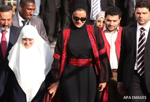 Qatar's First Lady Sheikha Mozah bint Nasser al-Missned leaves the Atfaluna Society for Deaf Children with the wife of Gaza's Hamas prime minister Ismail Haniya in the Gaza Strip on October 23, 2012. The Emir of Qatar en...