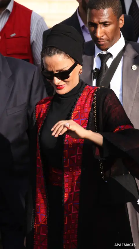Qatar's First Lady Sheikha Mozah bint Nasser al-Missned leaves the Atfaluna Society for Deaf Children in the Gaza Strip on October 23, 2012. The Emir of Qatar entered the Gaza Strip on Tuesday for a visit that broke the...