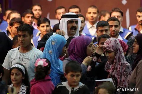 Qatari Emir Sheikh Hamad bin Khalifa al-Thani attends a celebration at the Islamic University in Gaza city on October 23, 2012. The Emir of Qatar entered the Gaza Strip on Tuesday for a visit that broke the isolation of...