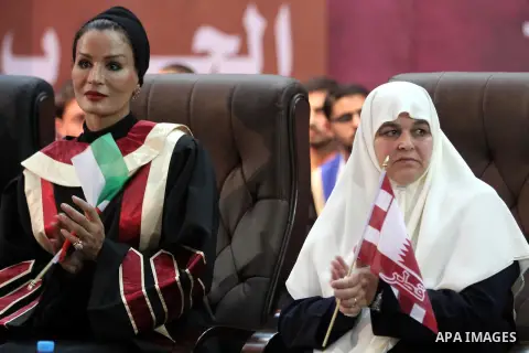 Qatar's First Lady Sheikha Mozah bint Nasser al-Missned sits with the wife of Gaza's prime minister Ismail Haniyah during a celebration at the Islamic University in Gaza city on October 23, 2012. The Emir of Qatar entere...
