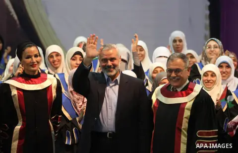 Palestinian prime minister in Gaza strip, Ismail Haniyah and Qatar's First Lady Sheikha Mozah bint Nasser al-Missned attend a celebration at the Islamic University in Gaza city on October 23, 2012. The Emir of Qatar ente...